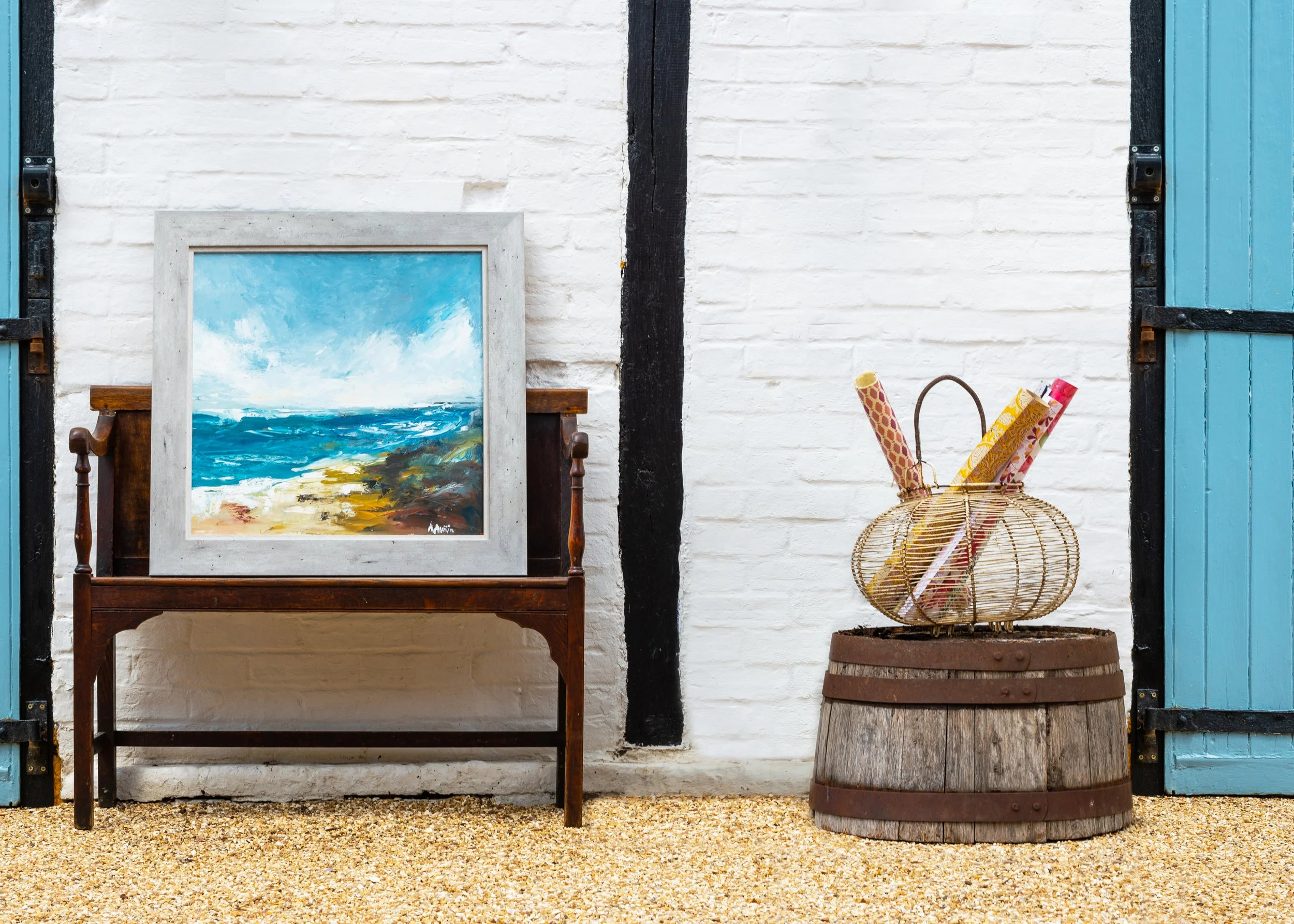 A coastal oil in a soft silver-grey frame, mounted to breathe.